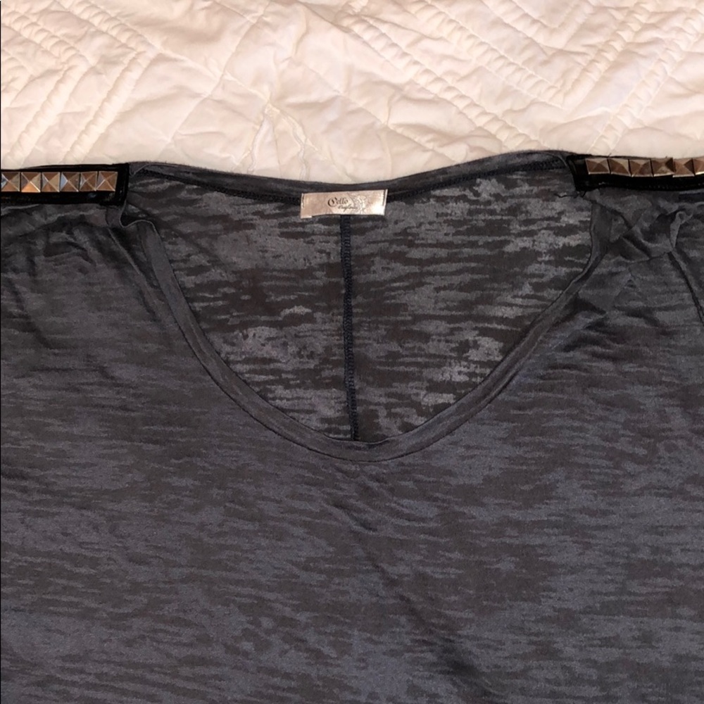 Dark grey tee shirt with a gold shoulder design